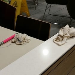 McDonald's - Dirty rags just sitting on tables. No employees anywhere cleaning.