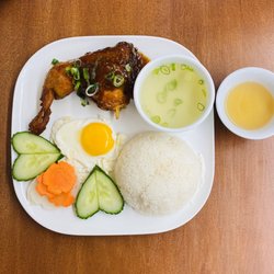 Roasted chicken leg and fried egg on broken rice