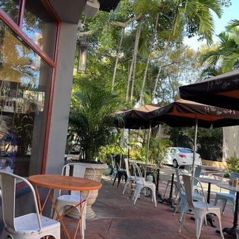 A La Folie Café - tables and chairs outside - French Near Me - Miami Beach, Florida A La Folie Café - tables and chairs outside - French Near Me - Miami Beach, Florida