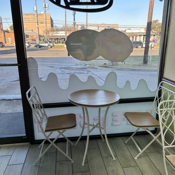 Crave Doughnut - a table and chairs in front of a window - Donuts Near Me - Dallas, Texas Crave Doughnut - a table and chairs in front of a window - Donuts Near Me - Dallas, Texas