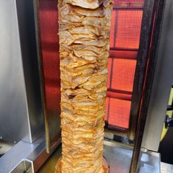 141 Main Street Deli Restaurant & Catering - Steak-style premium gyro by layering real marinated chicken and cooking it slowly on a vertical broiler