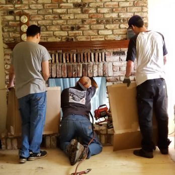 Loving's Fireplace - Ryan cutting out the rusted damper. His sons holding up shields, yes cardboard, to help protect the carpet. - Building Supplies Near Me - Upper Lake, California Loving's Fireplace - Ryan cutting out the rusted damper. His sons holding up shields, yes cardboard, to help protect the carpet. - Building Supplies Near Me - Upper Lake, California