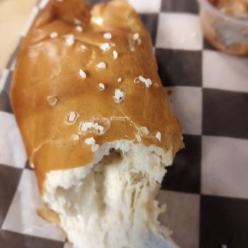 Spoonlickers - What's left of a giant soft pretzel with cider mustard and cheese sauce for dipping. - Desserts Near Me - Campbellsport, Wisconsin