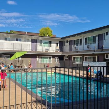 Luxe at Burbank - Residents enjoying the pool. - Apartments Near Me - Burbank, California Luxe at Burbank - Residents enjoying the pool. - Apartments Near Me - Burbank, California