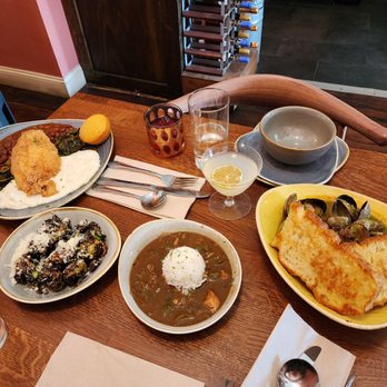 Jude's Old Town - The Grits plate with Fried Catfish Cajun Clams Brussel sprouts Gumbo bowl - Cajun/Creole Near Me - Seattle, Washington
