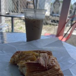 Apple fritter and a latte Apple fritter and a latte