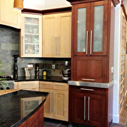 Hersh & Son Construction - The elegant cherry cabinet caps off this breathtaking kitchen by drawing the eye into the natural beauty and detail of this kitchen.