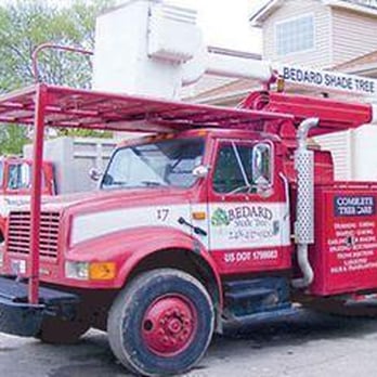 Bedard Shade Tree - a red truck parked in front of a house - Tree Services Near Me - New Hudson, Michigan Bedard Shade Tree - a red truck parked in front of a house - Tree Services Near Me - New Hudson, Michigan