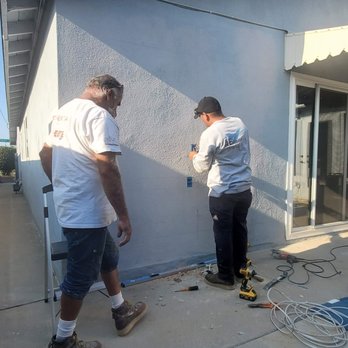 AE Modern Builders - two men working on a house - General Contractors Near Me AE Modern Builders - two men working on a house - General Contractors Near Me