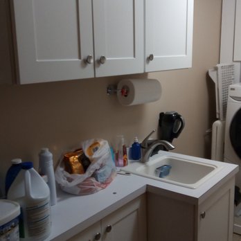 Meridian Surfaces - a laundry room with a washer and dryer - Countertop Installation Near Me - Oakland, New Jersey Meridian Surfaces - a laundry room with a washer and dryer - Countertop Installation Near Me - Oakland, New Jersey