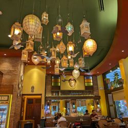 Lanterns and various mechanical birds and balloons on the ceiling of Mary Grace Uptown mall.