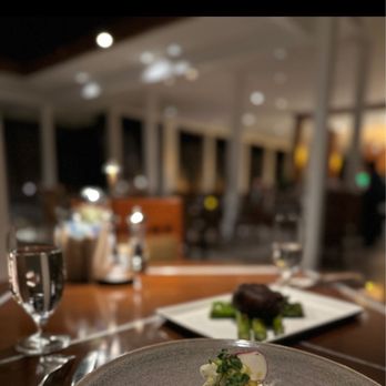 Pacific's Edge Restaurant - They said their halibut is the best, but it's so over cooked, and look at the risotto, water was surrounded it ? So mind blown - Seafood Near Me - Carmel, California