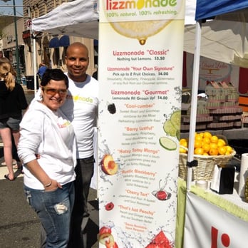 Lizzmonade - a man and a woman standing next to a sign - Street Vendors Near Me Lizzmonade - a man and a woman standing next to a sign - Street Vendors Near Me
