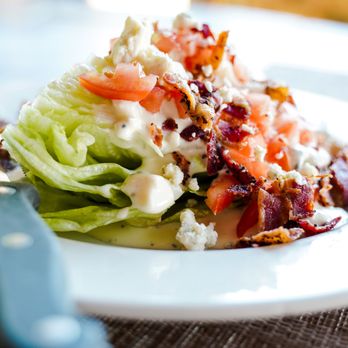Fireworks Restaurant - Classic Wedge Salad with your choice of house-made bleu cheese dressing or Chipotle Ranch. Served as a substitution side or an added salad. - American Near Me - Lincoln, Nebraska
