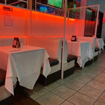 Sabor Latino - tables with white tablecloths in a restaurant - Latin American Near Me - Elmhurst, New York