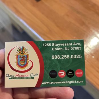 Tacos Mexican Grill - a hand holding a business card - Mexican Near Me - Union, New Jersey