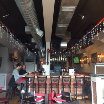 Fire Engine Pizza Company - Main patio up front looking back into the bar area. - Pizza Near Me - Bridgeport, Connecticut Fire Engine Pizza Company - Main patio up front looking back into the bar area. - Pizza Near Me - Bridgeport, Connecticut