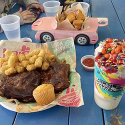 Amigos Dells  in the Grateful Shed - Half Rack BBQ Ribs, Kids Chicken Nuggets + Birthday Shake