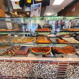 Pizza choices in front display Pizza choices in front display