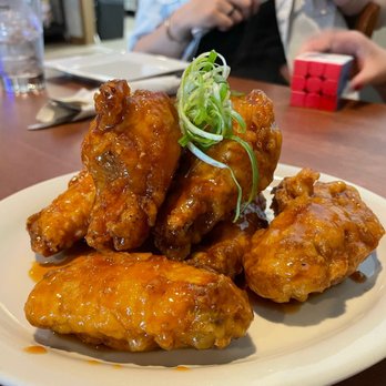 Mint Kitchen & Bar - a plate of chicken wings - Vietnamese Near Me - Worcester, Massachusetts