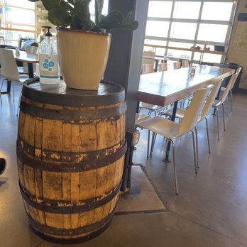 Trailhead Cafe - a wooden barrel with a planter on top - Breakfast & Brunch Near Me - Berthoud, Colorado