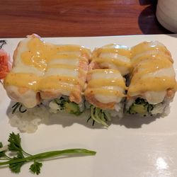 Sakura Sushi & Grill - Alaska roll with baked mozzarella. Yes it's strange, it's also fantastic.