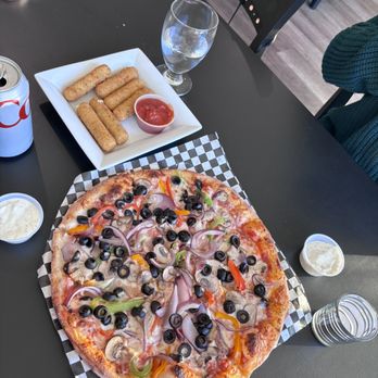 Lounge 51 - a pizza with olives, peppers, and cheese - Pizza Near Me - Tarzana, California Lounge 51 - a pizza with olives, peppers, and cheese - Pizza Near Me - Tarzana, California
