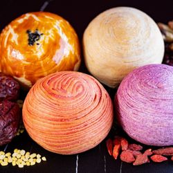 The Foundry Bakery - Mooncakes -- Jujube date (red), Taro (purple], Saltes duck yolk (sesame seed top), Mung bean (white)