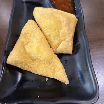 Tsukiro Japanese Restaurant - 2 crab ragoons with dipping sauce - Japanese Near Me - Jacksonville, North Carolina Tsukiro Japanese Restaurant - 2 crab ragoons with dipping sauce - Japanese Near Me - Jacksonville, North Carolina