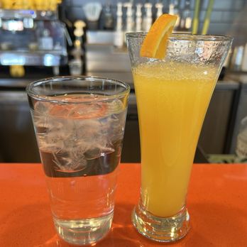 Snooze, an A.M. Eatery - Mimosa and water - Breakfast & Brunch Near Me - Denver, Colorado Snooze, an A.M. Eatery - Mimosa and water - Breakfast & Brunch Near Me - Denver, Colorado