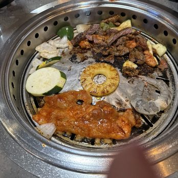 KPOT Korean BBQ & Hot Pot - Us cooking our food. Forgot to take a picture of the soup. - Korean Near Me - Ocala, Florida KPOT Korean BBQ & Hot Pot - Us cooking our food. Forgot to take a picture of the soup. - Korean Near Me - Ocala, Florida