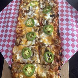 Sausage and mushroom flatbread with jalapeños.
