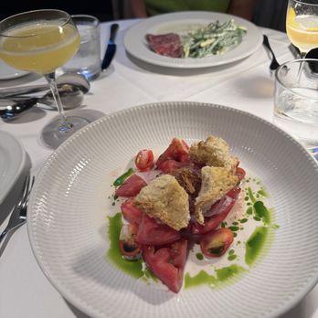 Black+Blue Toronto - Heirloom tomato salad (wagyu tataki in back) - Steakhouses Near Me - Toronto, Ontario