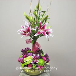 Huddart Floral - Try something a little different next time with a floral topiary from Huddart Floral!