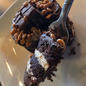 Halwa Bakery & Cafe - A piece of the Peanut Butter Cake on a fork. - Cafes Near Me - Blacksburg, Virginia Halwa Bakery & Cafe - A piece of the Peanut Butter Cake on a fork. - Cafes Near Me - Blacksburg, Virginia