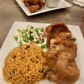 El Rincon Tropical - Fried pork chop dinner with rice and peas and side salad - Puerto Rican Near Me - Virginia Beach, Virginia