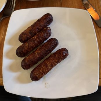 Polite Society - Chicken Cranberry Sausage. They're savory, with just enough sweetness from the cranberry. - New American Near Me - St Louis, Missouri Polite Society - Chicken Cranberry Sausage. They're savory, with just enough sweetness from the cranberry. - New American Near Me - St Louis, Missouri