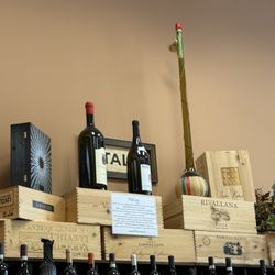 Unusual wine bottle on top shelf