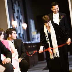 Opening the aisle for the bride and groom