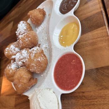Cheryl’s on 12th - Beignet Bliss and bliss it is! A flight of Fresh Beignets topped w/ Powdered Sugar. and flavors - Breakfast & Brunch Near Me - Portland, Oregon Cheryl’s on 12th - Beignet Bliss and bliss it is! A flight of Fresh Beignets topped w/ Powdered Sugar. and flavors - Breakfast & Brunch Near Me - Portland, Oregon