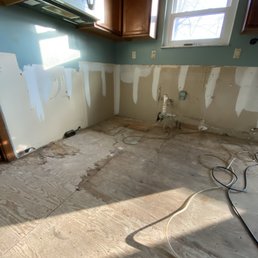 Plywood kitchen area damaged by leaking water
