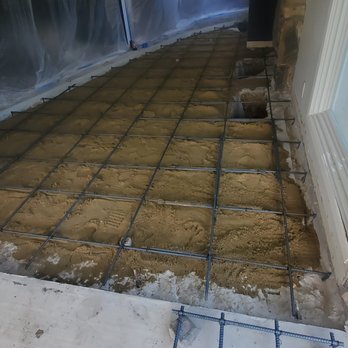 Foundation Builders - Another view of the under-pin holes and rebar. - Foundation Repair Near Me - North Hollywood, California