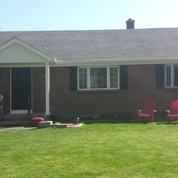 R & R's Remodeling - After. New roof, new shutters, new painted red front door, porch roof and pillars, trim around the top and bottom of the pillars - General Contractors Near Me - Buffalo, New York R & R's Remodeling - After. New roof, new shutters, new painted red front door, porch roof and pillars, trim around the top and bottom of the pillars - General Contractors Near Me - Buffalo, New York