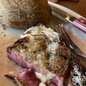 Saltgrass Steak House - Halved Pats Ribeye Medium Rare with butter on top. Baked potato with butter and sour cream. Delish - Steakhouses Near Me - Rogers, Arkansas Saltgrass Steak House - Halved Pats Ribeye Medium Rare with butter on top. Baked potato with butter and sour cream. Delish - Steakhouses Near Me - Rogers, Arkansas