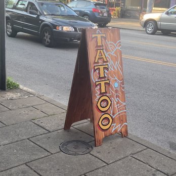 Triumph Tattoo - Outdoor sign - Piercing Near Me - Louisville, Kentucky Triumph Tattoo - Outdoor sign - Piercing Near Me - Louisville, Kentucky