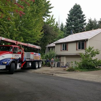 Cravenho Construction & Building - a truck parked in front of a house - General Contractors Near Me