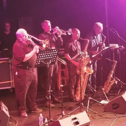 The Music Mart - Tom (Store Owner) with his band.