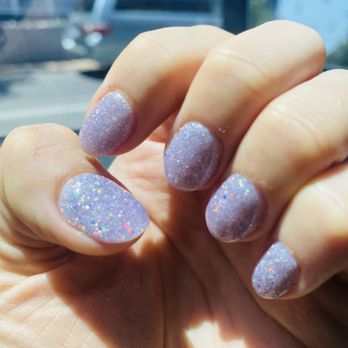 Enza Nails & Lashes - Sunlight hitting the dipped nails - Nail Salons Near Me - Austin, Texas