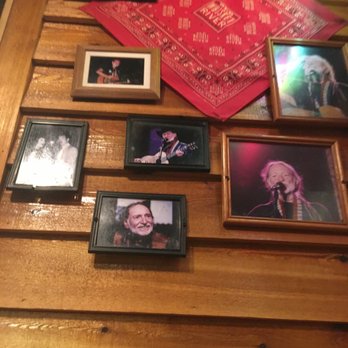 Texas Roadhouse - Sitting by the wall of photos of a great legend Willie Nelson at Texas Road house for dinner. - Steakhouses Near Me - Denton, Texas Texas Roadhouse - Sitting by the wall of photos of a great legend Willie Nelson at Texas Road house for dinner. - Steakhouses Near Me - Denton, Texas