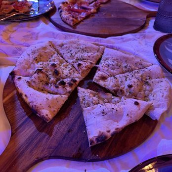 Marcello Pizza Napoli - Focaccia bread. Amazing garlic flavor with a nice salty bite. - Caterers Near Me Marcello Pizza Napoli - Focaccia bread. Amazing garlic flavor with a nice salty bite. - Caterers Near Me